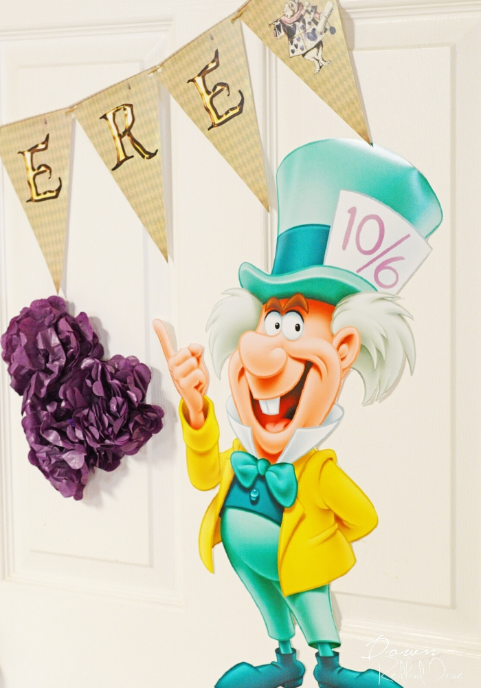 mad hatter wall cutout decor with an alice in wonderland birthday banner printable