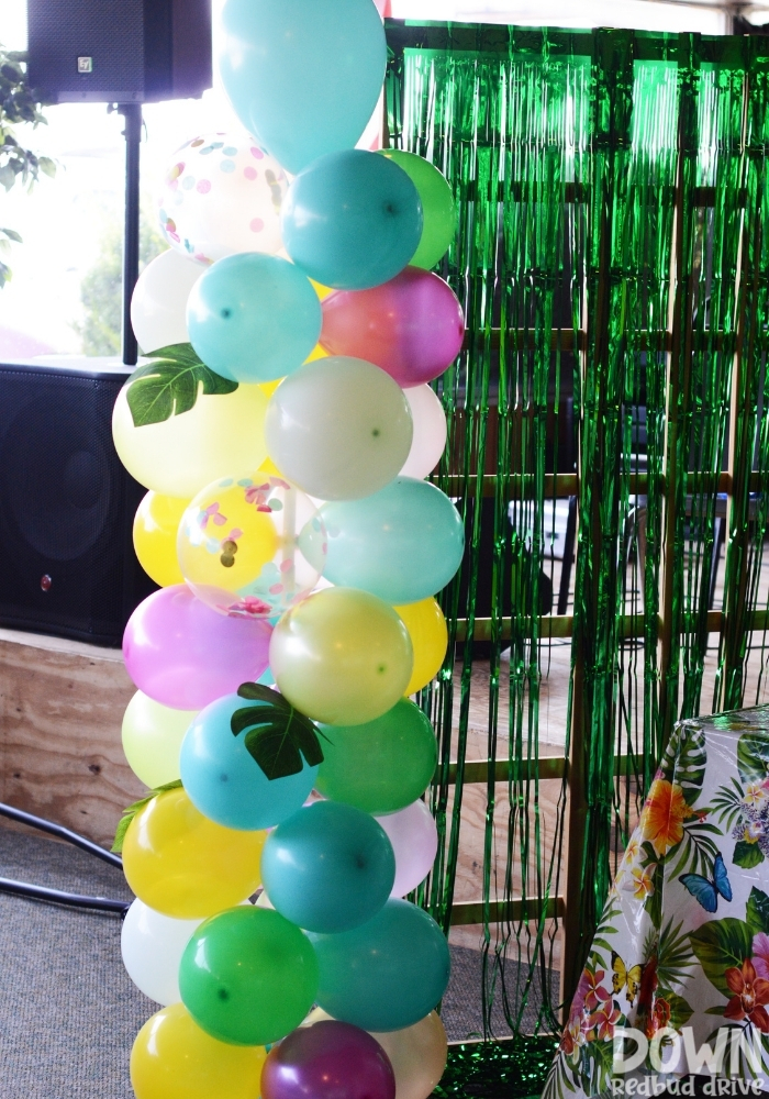 A closeup of a tropical themed balloon tower.