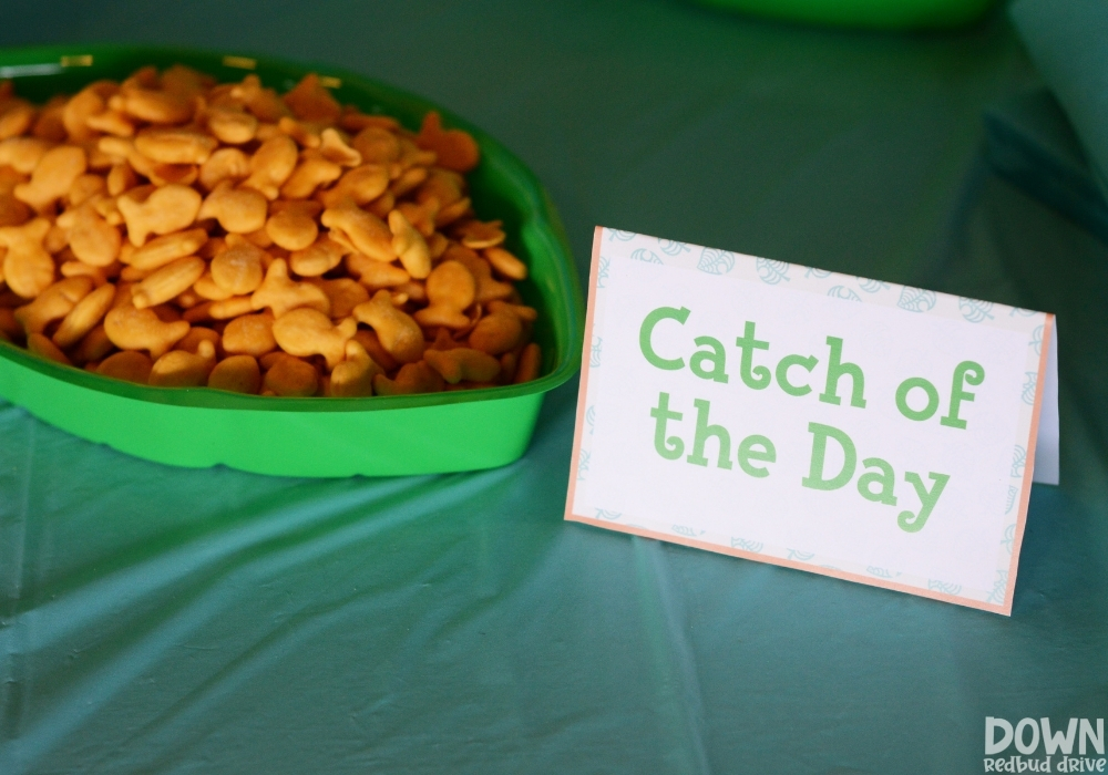 Closeup up of the "Catch of the Day" food card with goldfish crackers next to it.