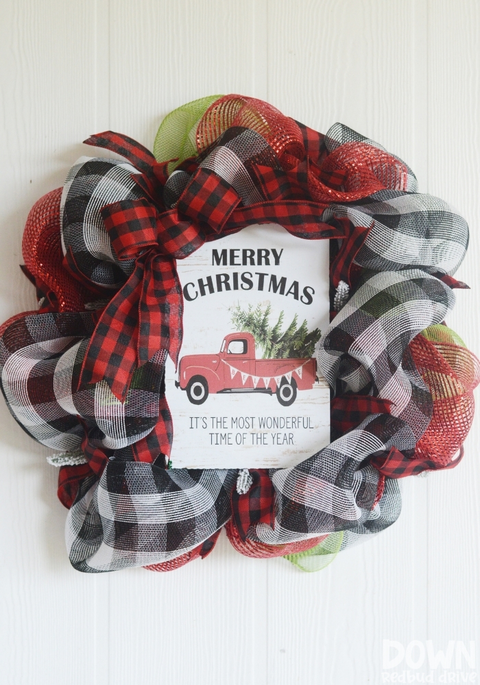 A tall close up of the finished Christmas Mesh Wreath DIY .