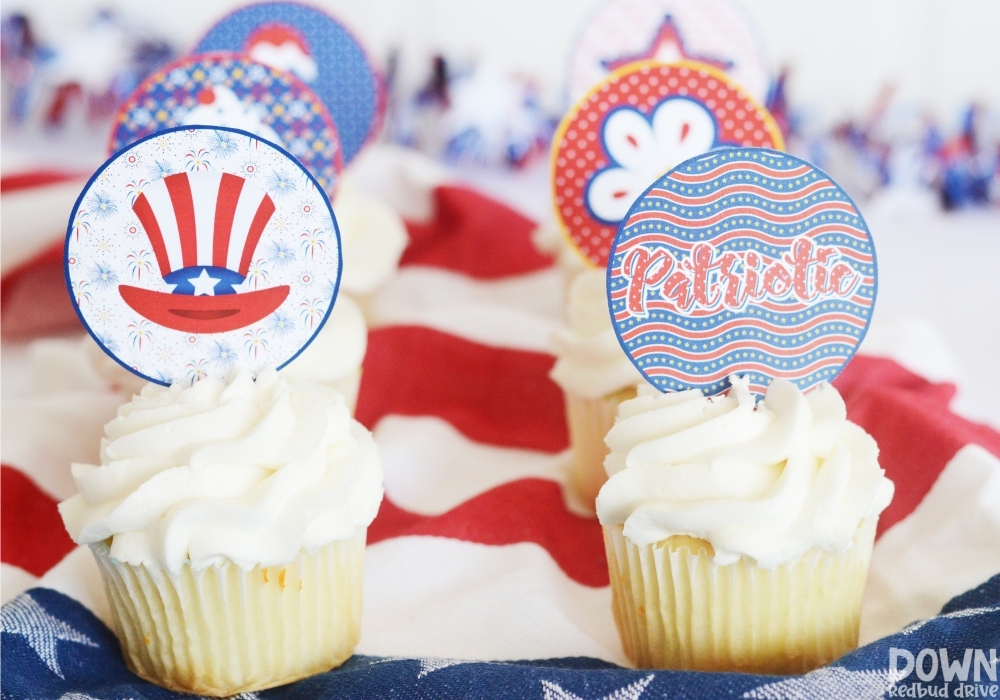 Cupcakes decorated with patriotic cupcake toppers.