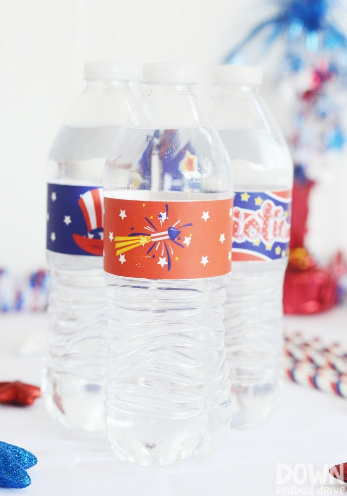 Tall close up of water bottles with patriotic labels on them.