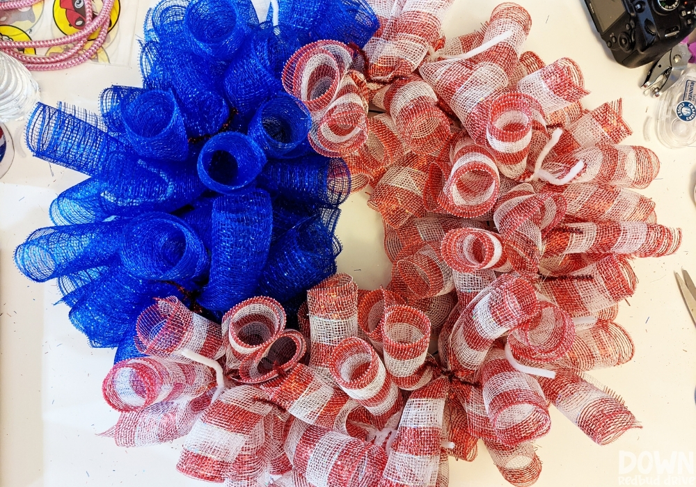 Overhead view of the blue and red / white deco mesh added to a wreath form for the DIY American Flag Mesh Wreath.