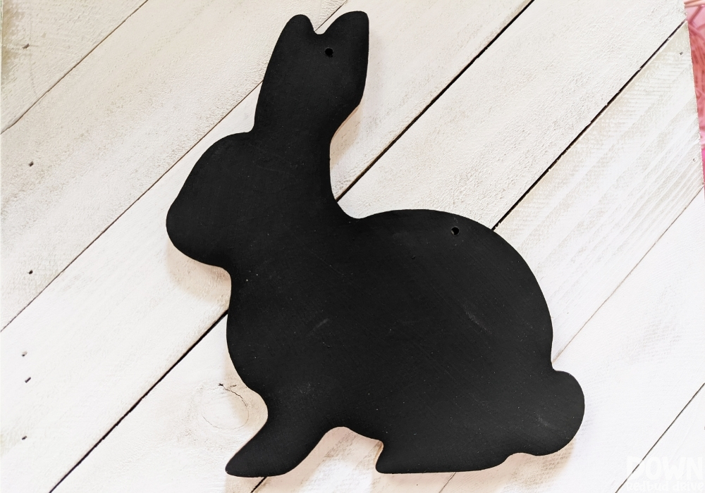 The black painted bunny decoration for the DIY Buffalo Plaid Easter Sign.