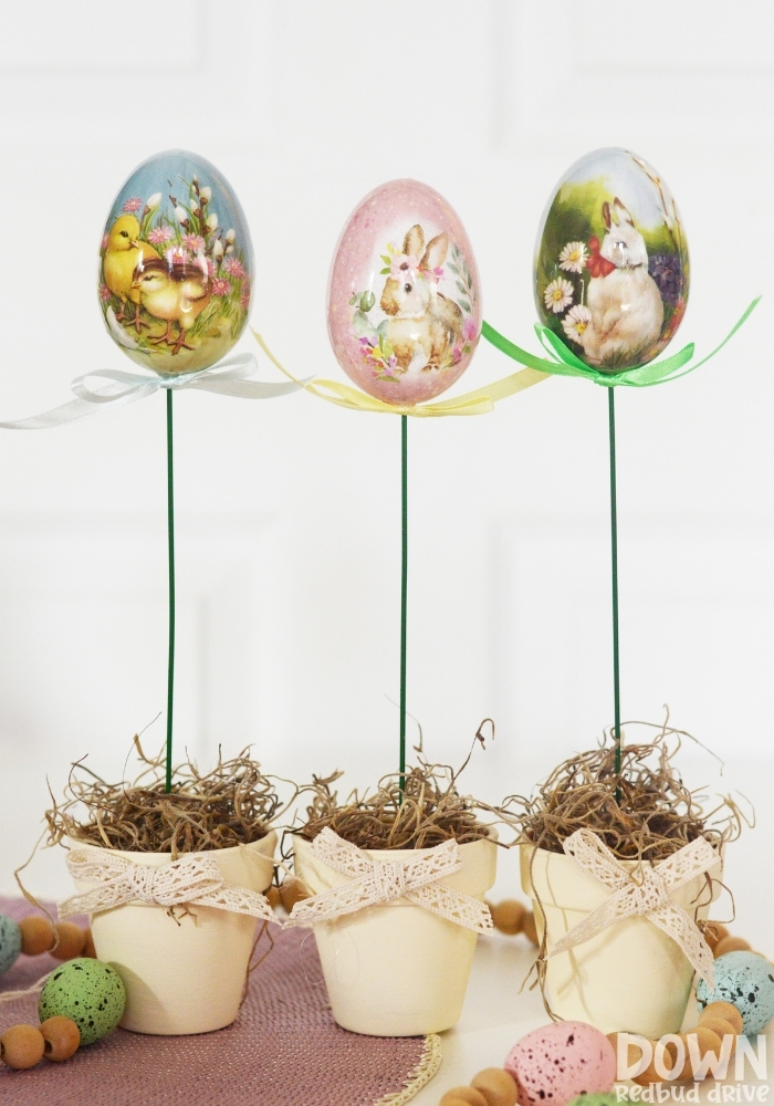 A tall shot of the finished DIY Easter Egg Topiaries.