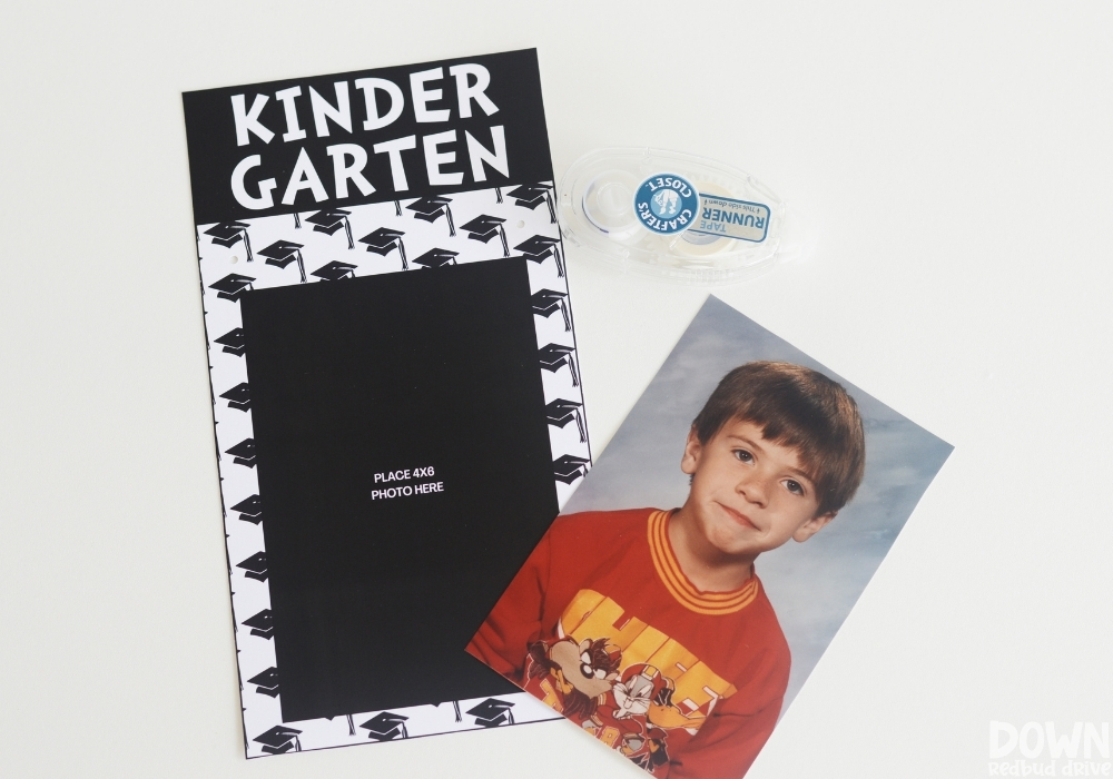 A kindergarten school picture and double sided tape next to a kindergarten printable photo frame.