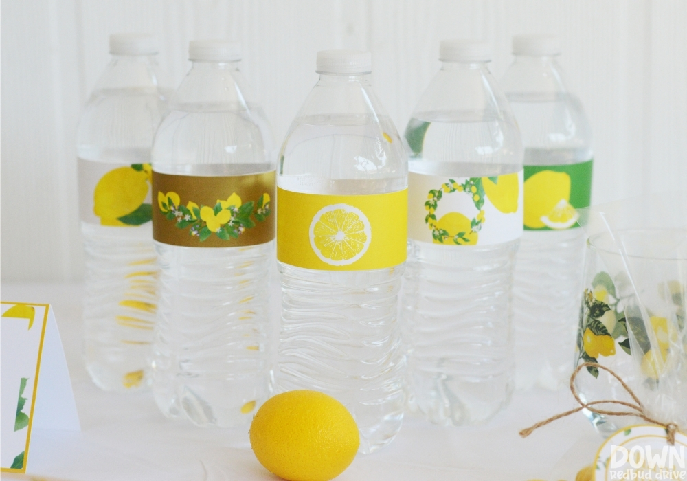 Wide close up of the lemon themed water bottle labels.