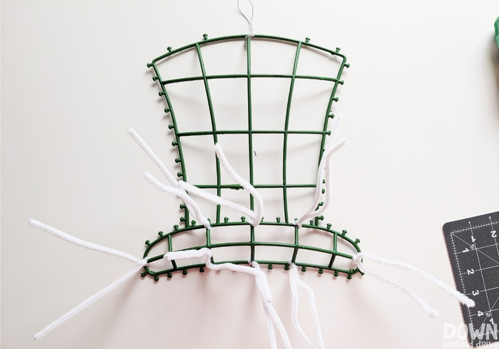 How to attach pipe cleaners to a wire wreath form for mesh wreaths.