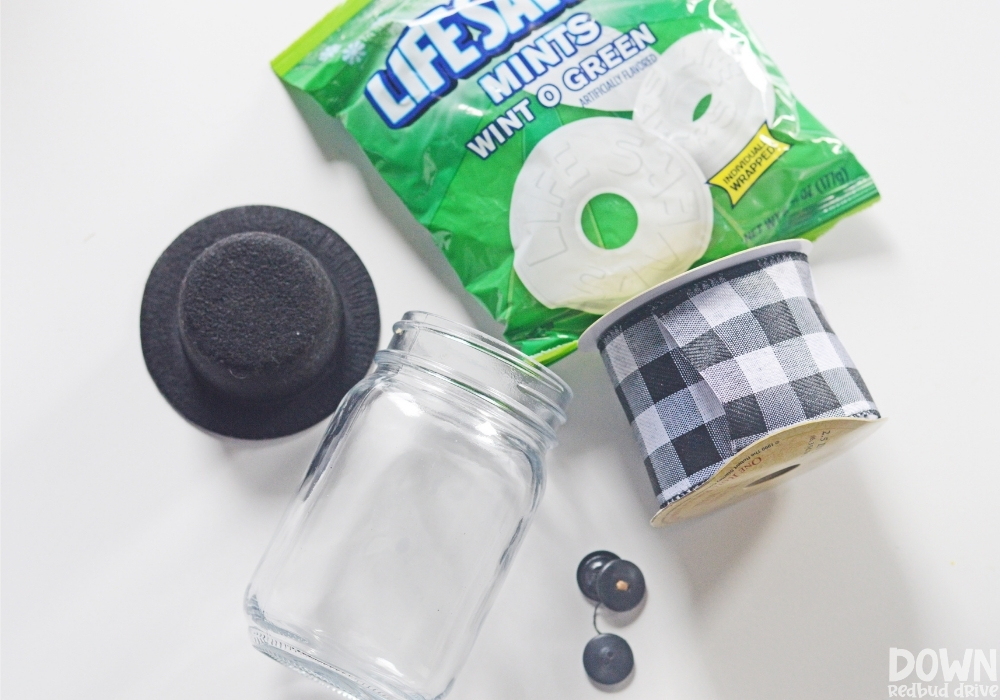 The supplies for the DIY Lifesaver Snowman Gift laid out on a white background.