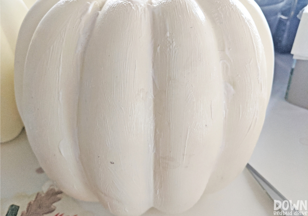 Picture of a decorative pumpkin covered in Mod Podge for the DIY Napkin Pumpkins.