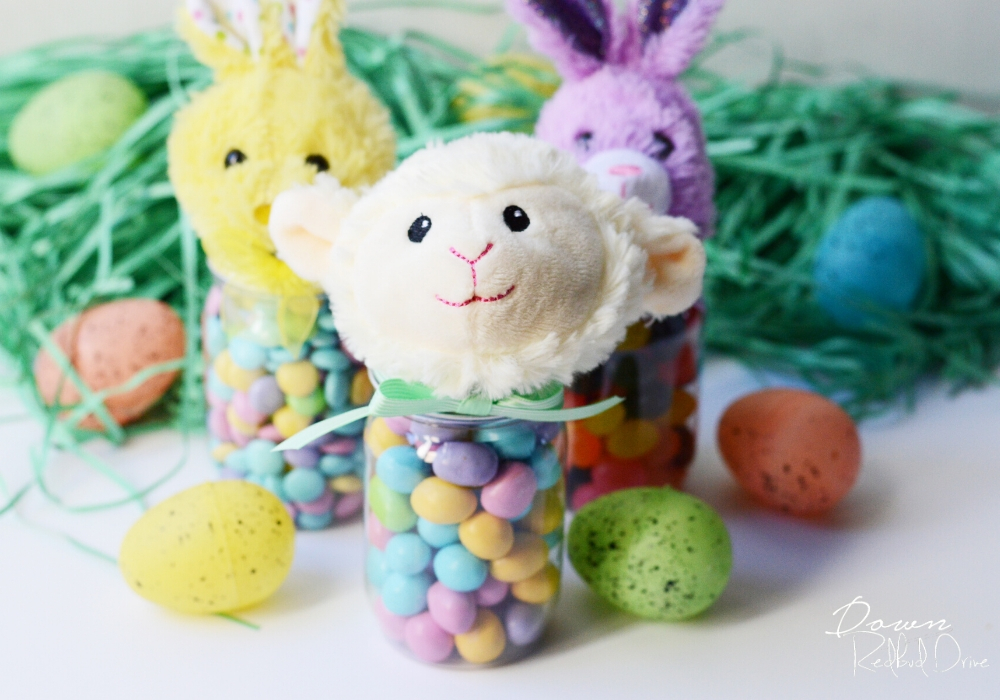 easter candy jars srrounded by easter grass and plastic easter eggs