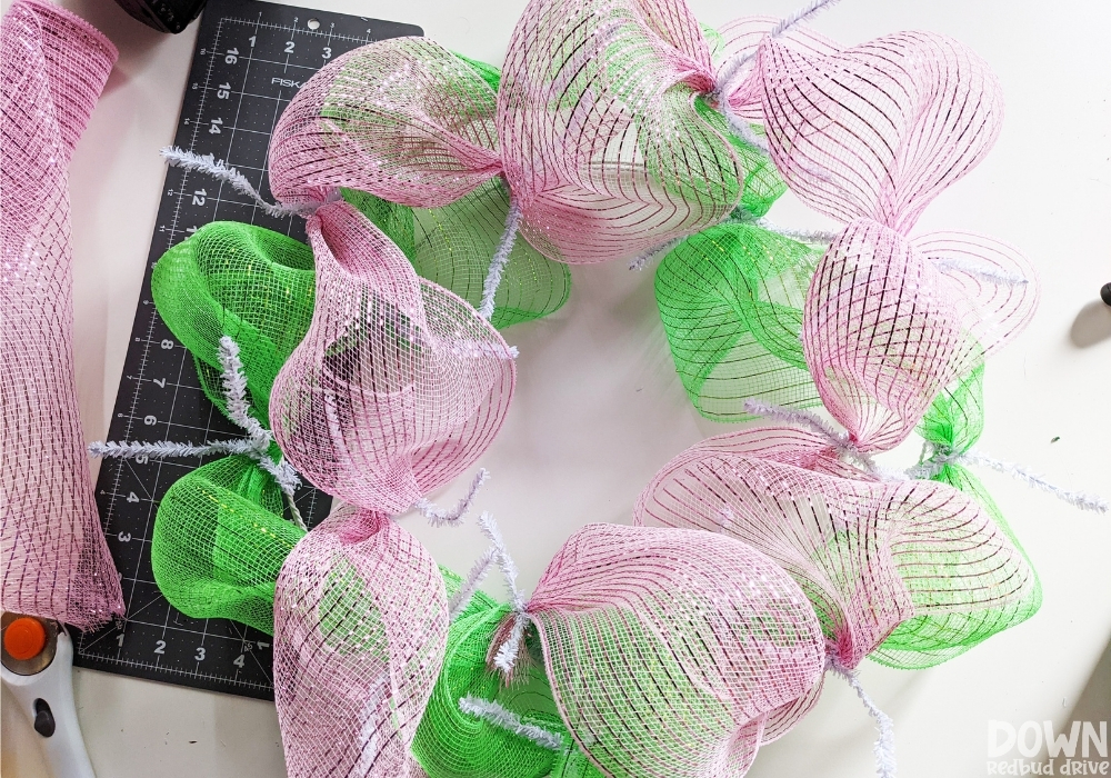 Closeup of the pink mesh added to the wreath form.