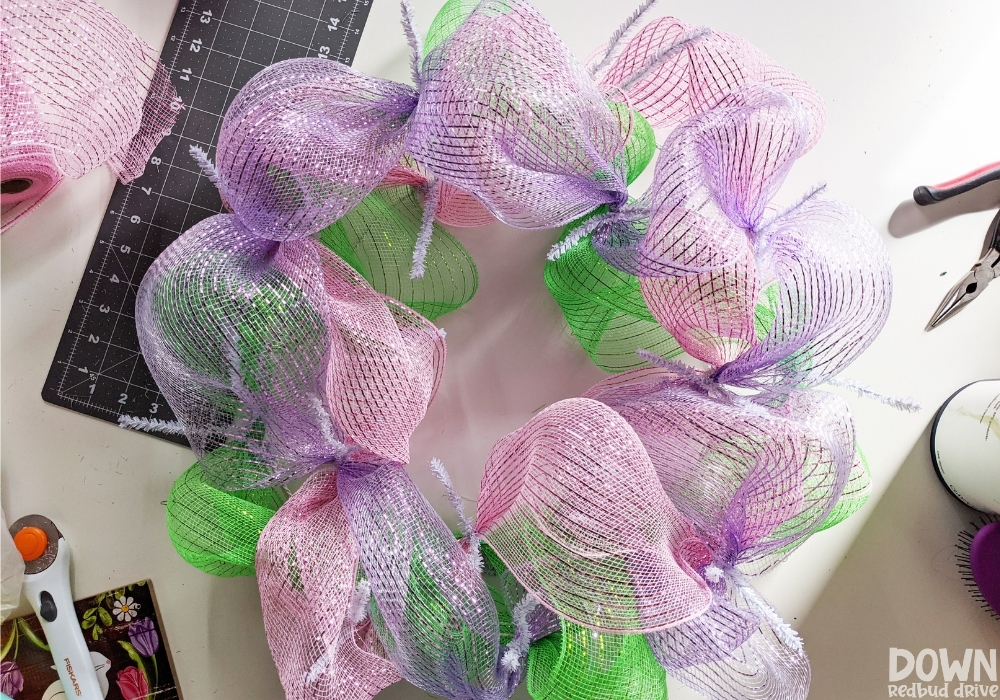 Closeup of the purple mesh added to the wreath form.