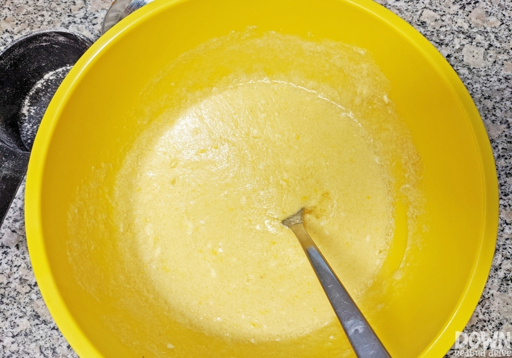 Overhead view of the wet ingredients added to a mixing bowl for the Fall Sprinkle Cookies.