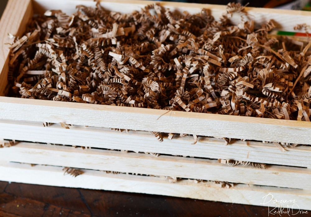 paper shred in a wooden crate