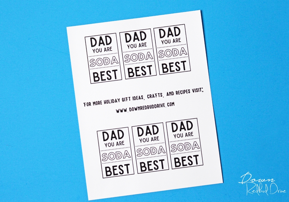 a printed sheet of father's day soda gift tags on a blue background