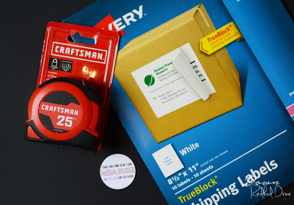 a craftsman tape measure on top of Avery sticker paper and a printable diy father's day tape measure gift label on a black background