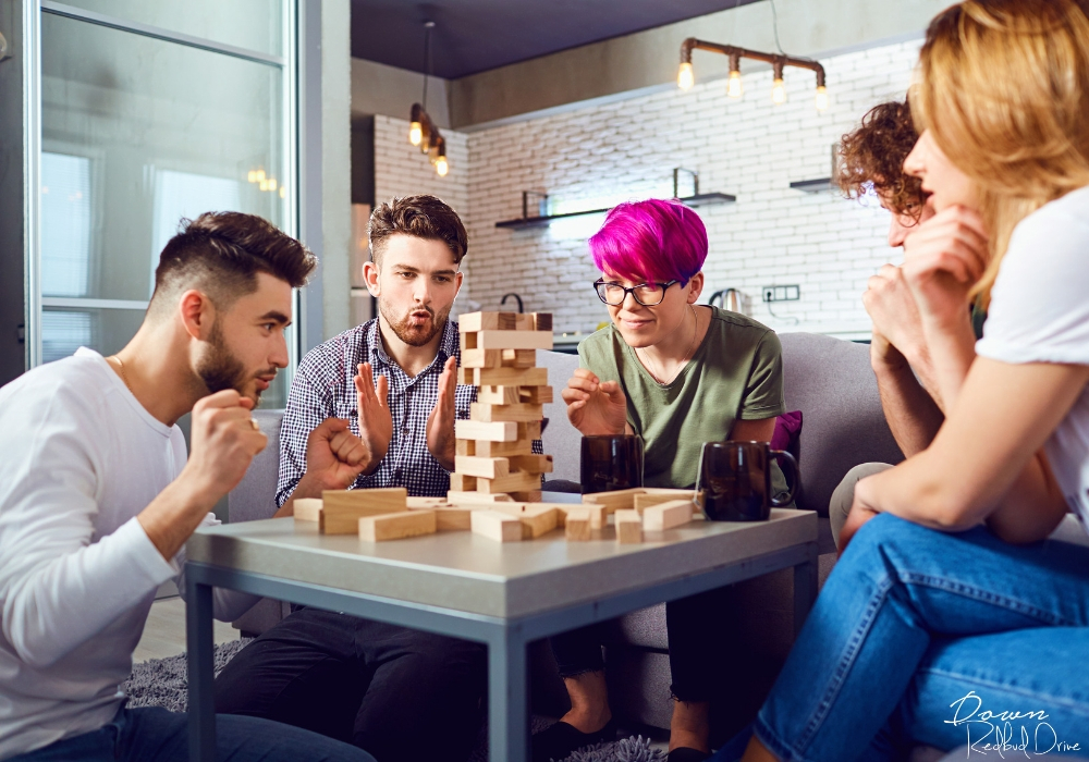 young adults playing Jenga