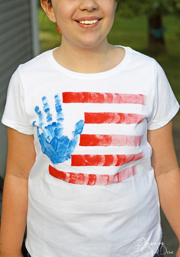 Preteen wearing a Hand Print American Flag Shirts