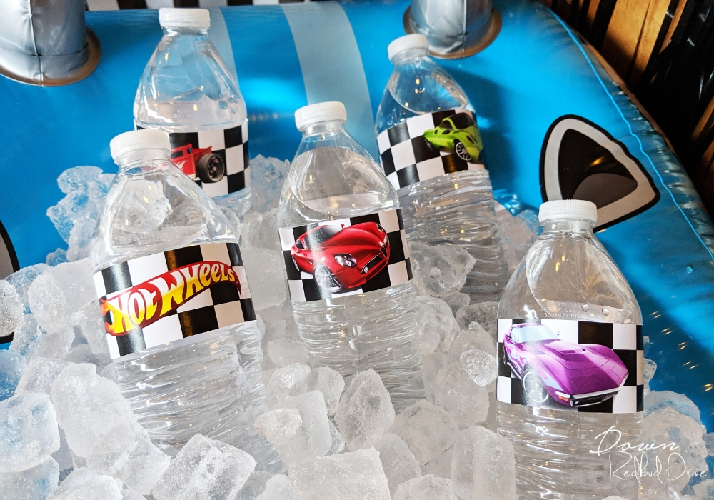 water bottles with hot wheels printable water bottle labels on them sitting in ice