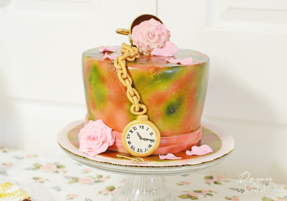 alice in wonderland birthday cake shaped like the mad hatter's hat