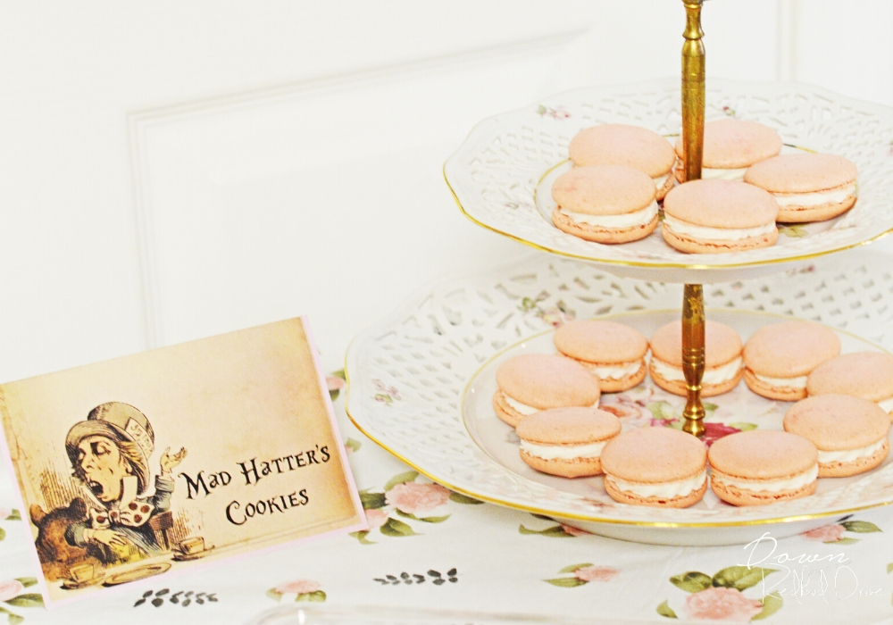 mad hatter's cookies card with a tiered tray of pink macarons