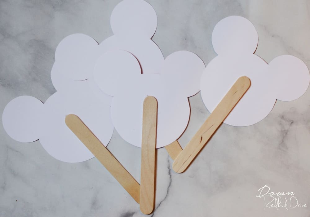 popsicle sticks glued to paper mickey heads