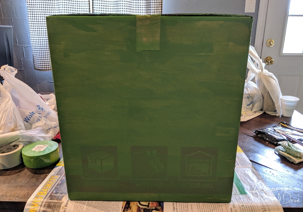 painted green box on a wooden table