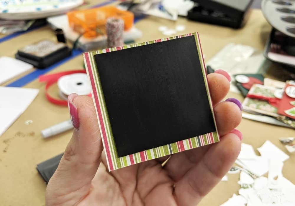 square magnet attached to a piece of paper