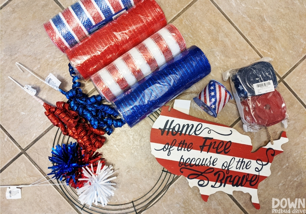 The supplies for the Patriotic Deco Mesh Wreath laid out.