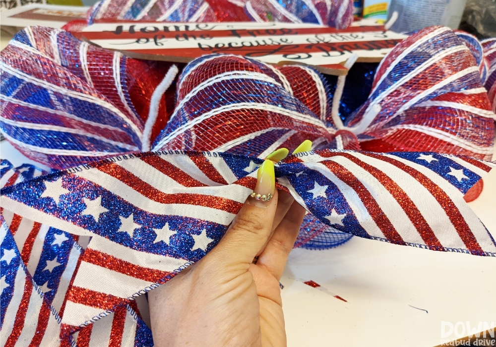 Close up of the patriotic ribbon that's going to be attached to the Patriotic Deco Mesh Wreath.