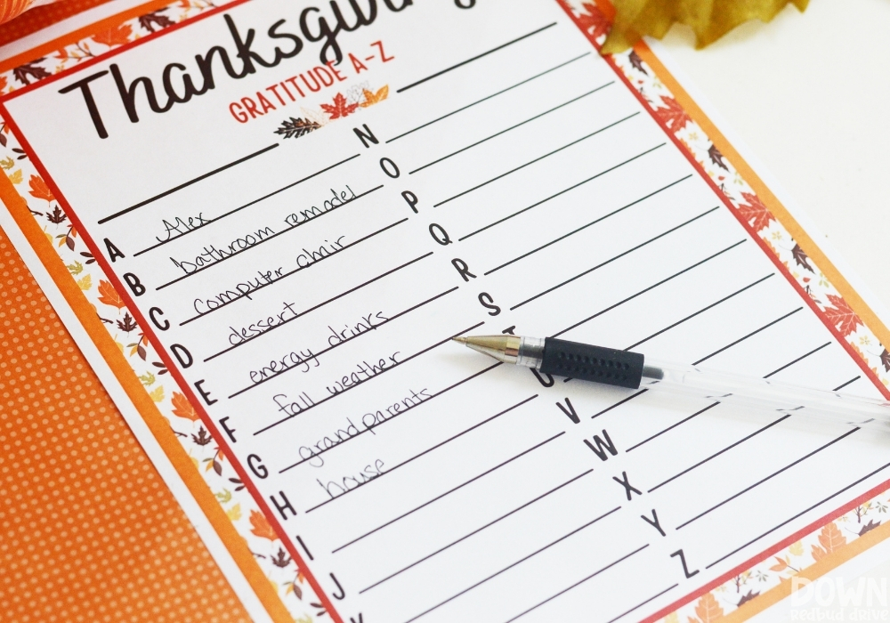 A close up of the thanksgiving gratitude list filled out for letters A through H.