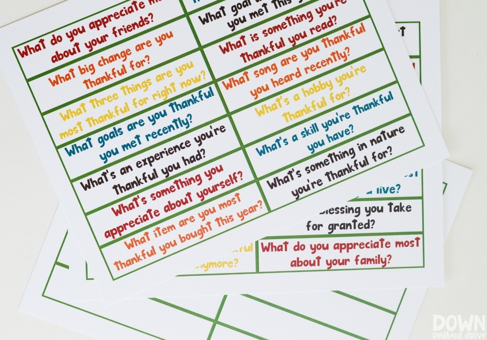 Overhead view of the thanksgiving conversation starters printables.