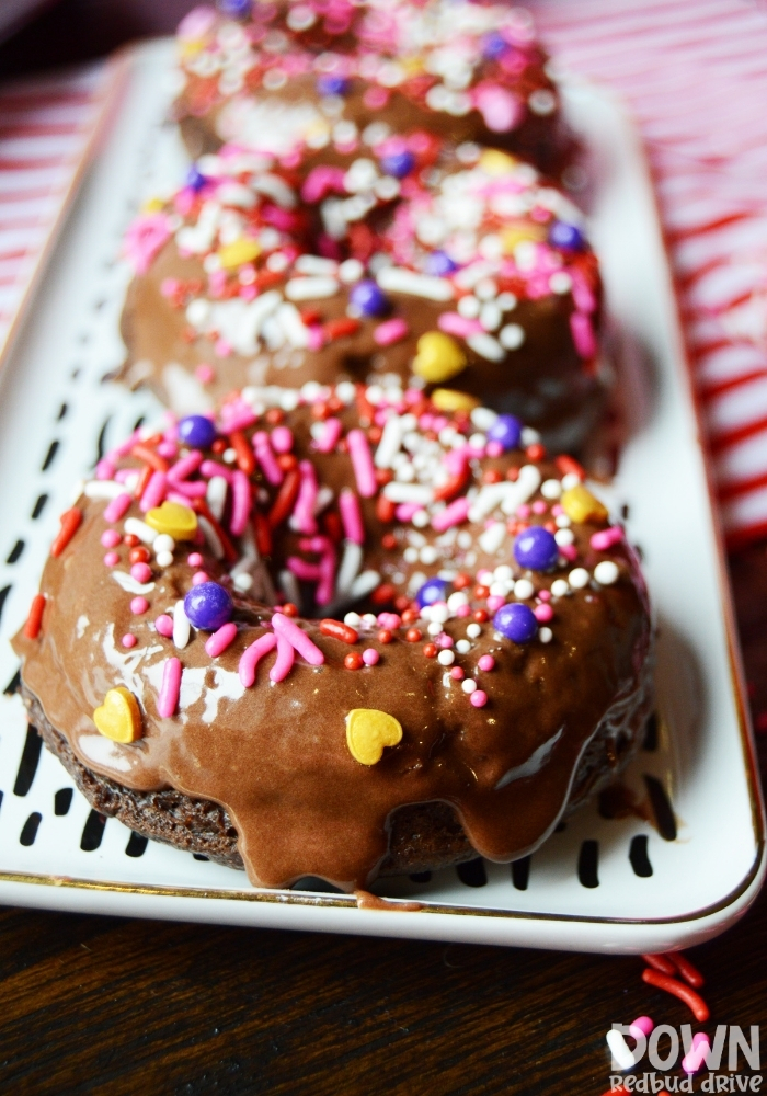 Chocolate frosted Valentine donuts with Valentine sprinkles.