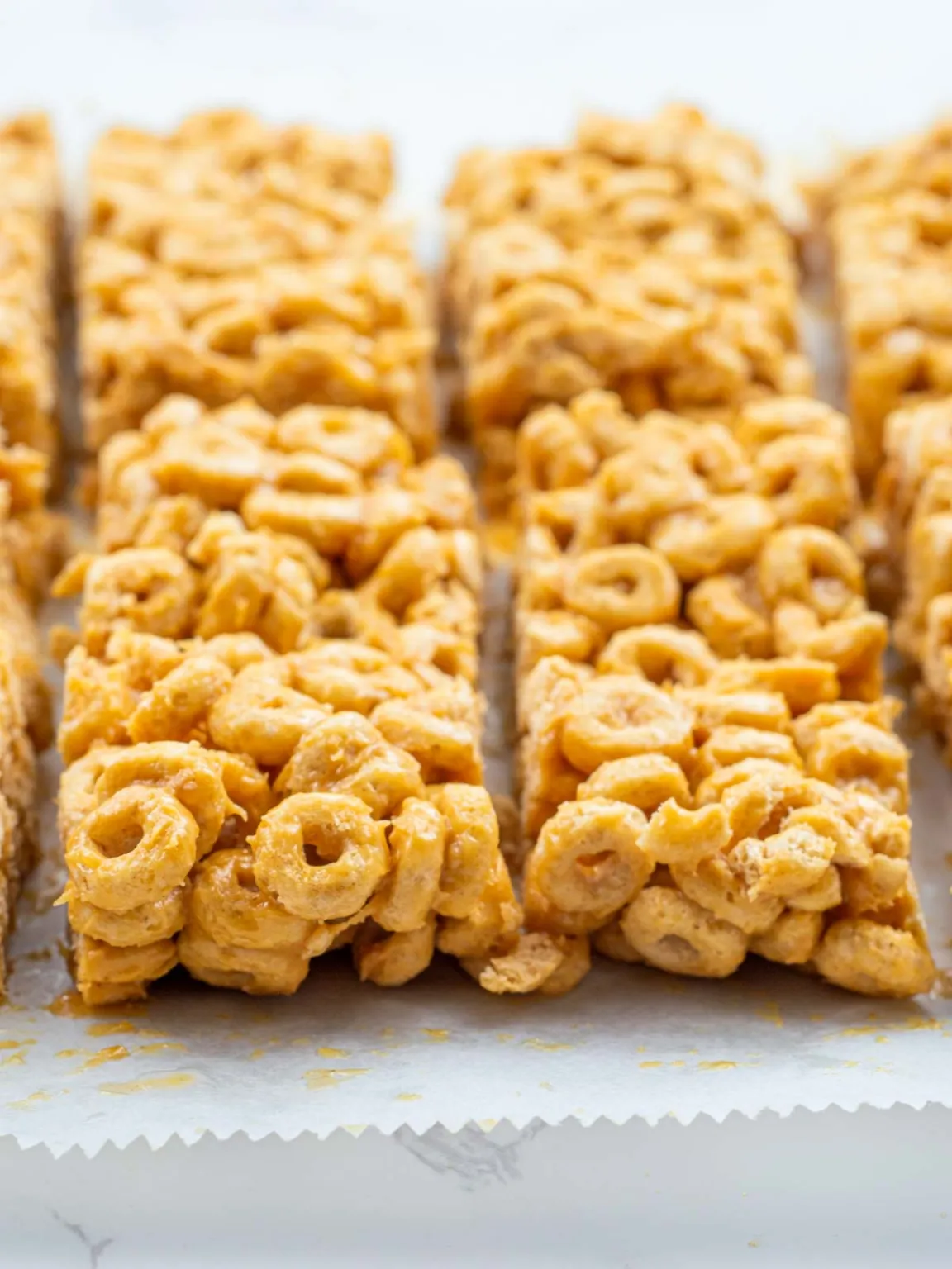 8 cheerio cereal bars on white parchment