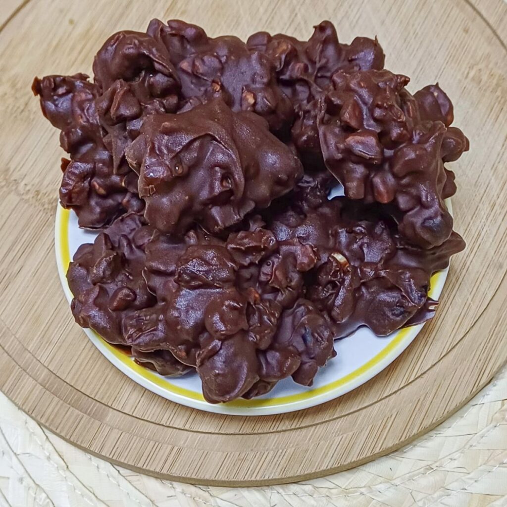 a plate of finished chocolate fruit nut clusters