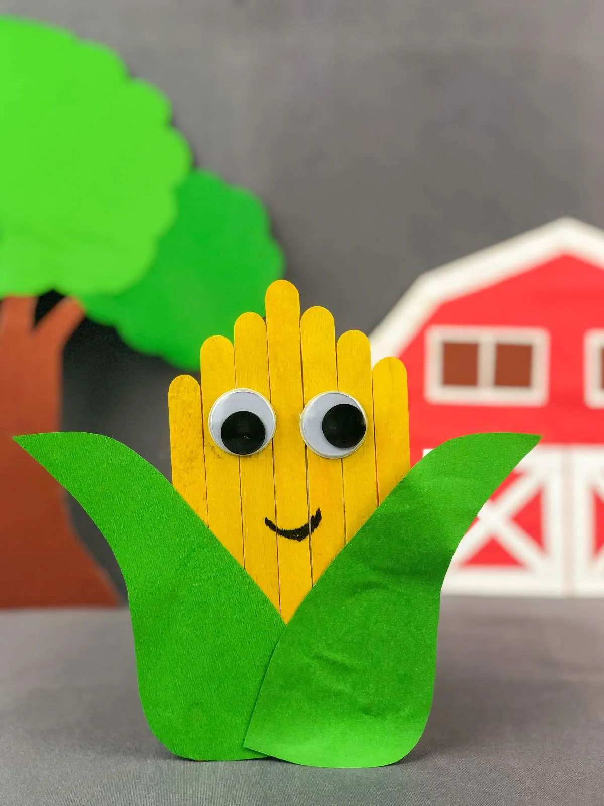 a finished popsicle craft made to look like an ear of corn that has been harvested