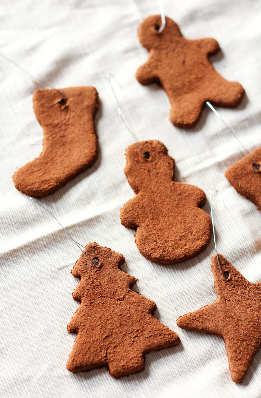 cinnamon dough christmas ornaments in various seasonal shapes