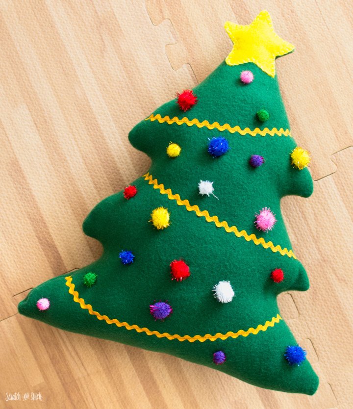 a stuffed christmas tree craft that kids can sew and decorate