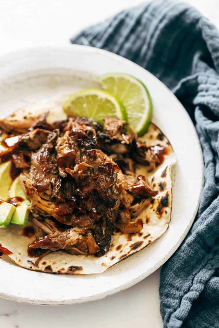 Crockpot carnitas on toasted tortillas