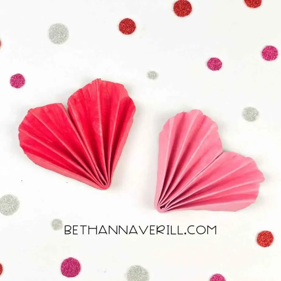 Folded paper to look like seashell hearts for valentine's day