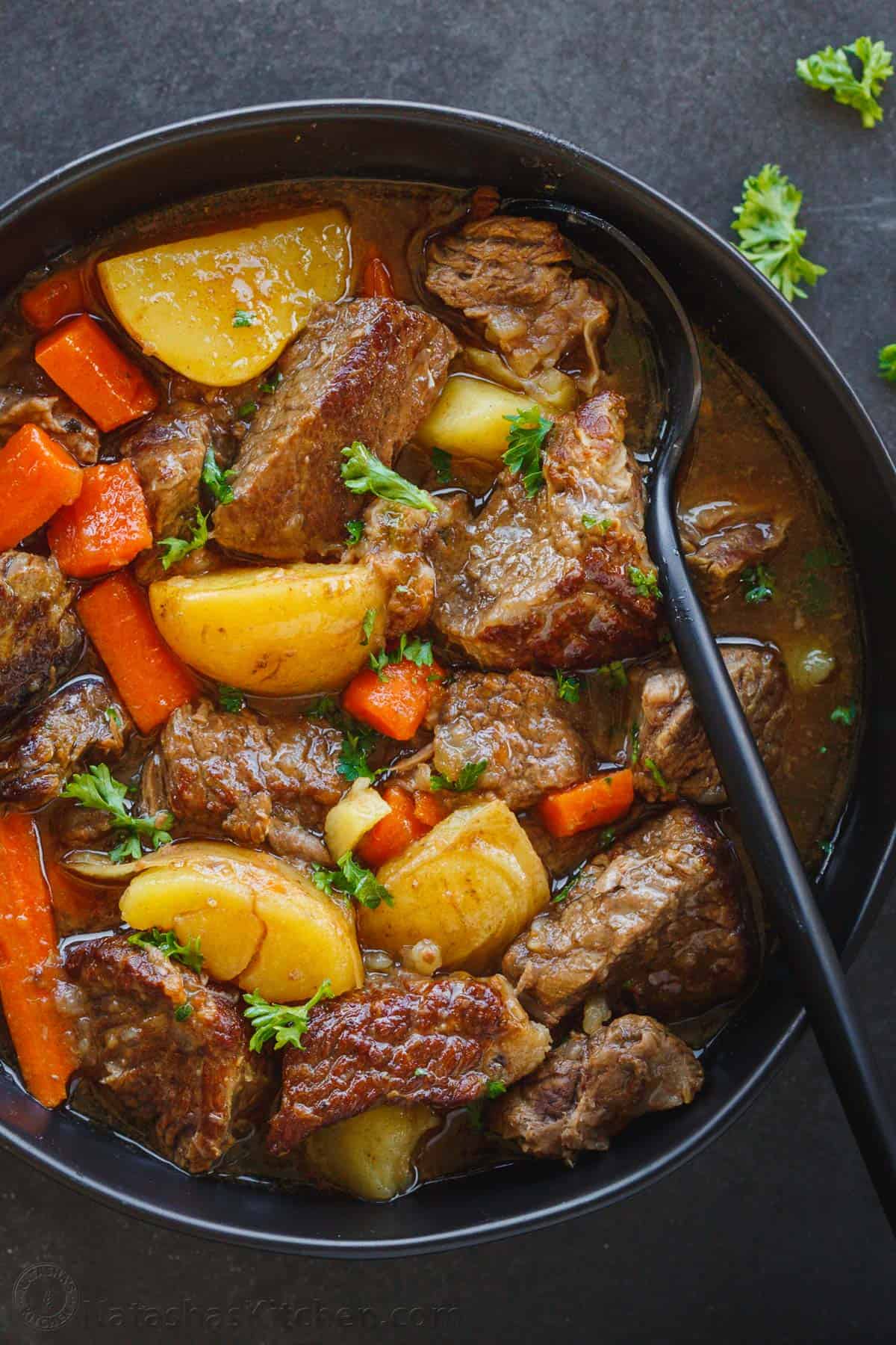 black bowl of crockpot beef stew